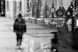 black hat walking