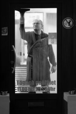 window cleaner in a dressing gown